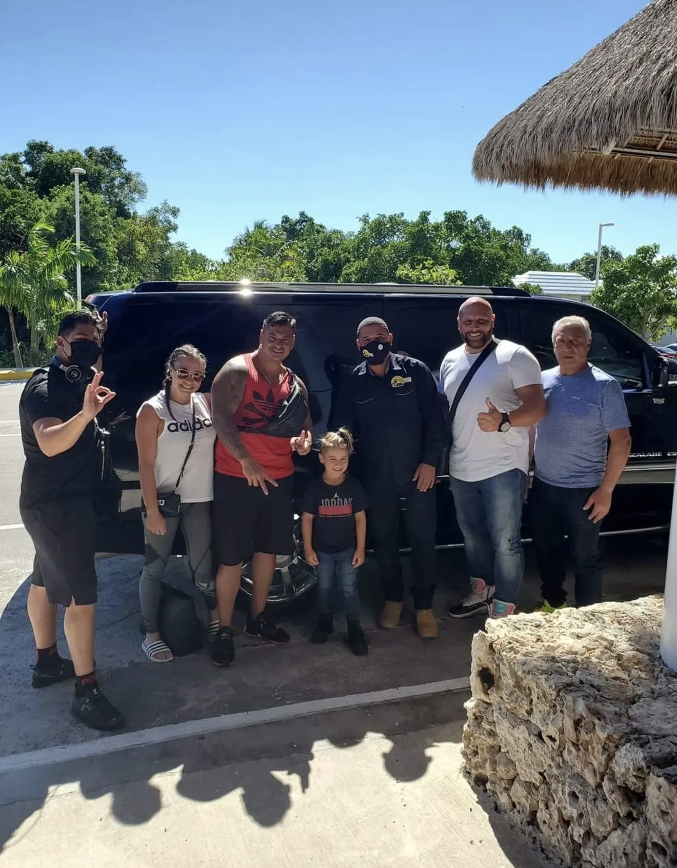 Guest posing with First Class Transfer Punta Cana driver